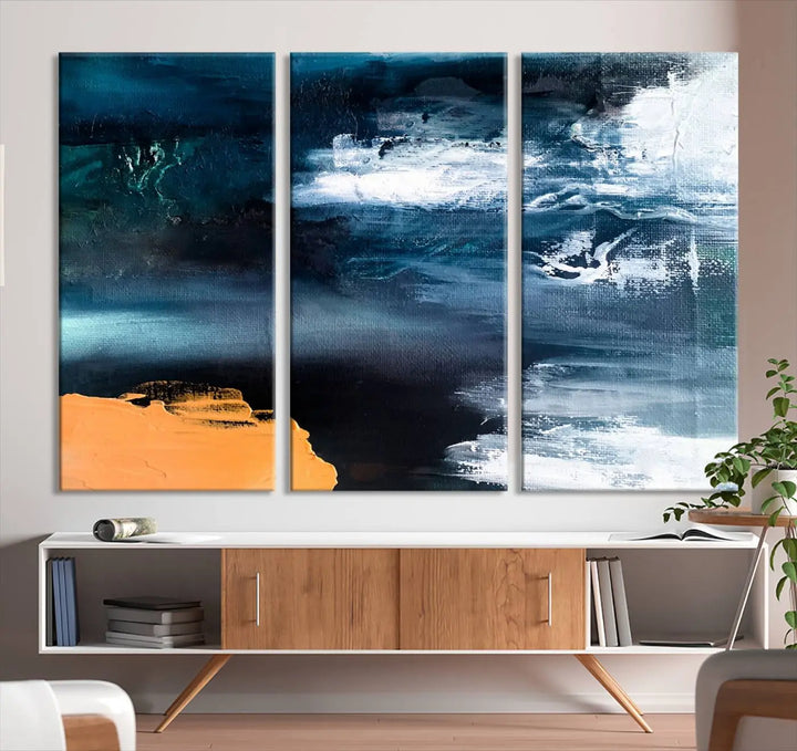 The stunning Nautical Abstract Ocean Canvas Wall Art Print in blue, white, and a touch of orange on museum-quality canvas.