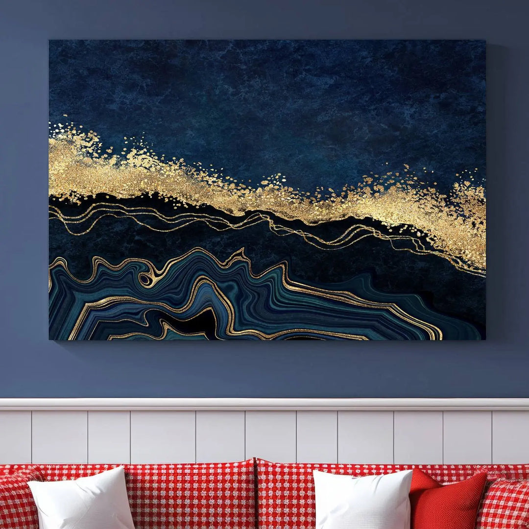 A modern living room featuring a ready-to-hang Navy Blue Marble Fluid Effect Large Wall Art, a stunning abstract triptych on museum-quality canvas in blue and gold. The artwork's vibrant colors are preserved with an enhanced UV-protective coating.