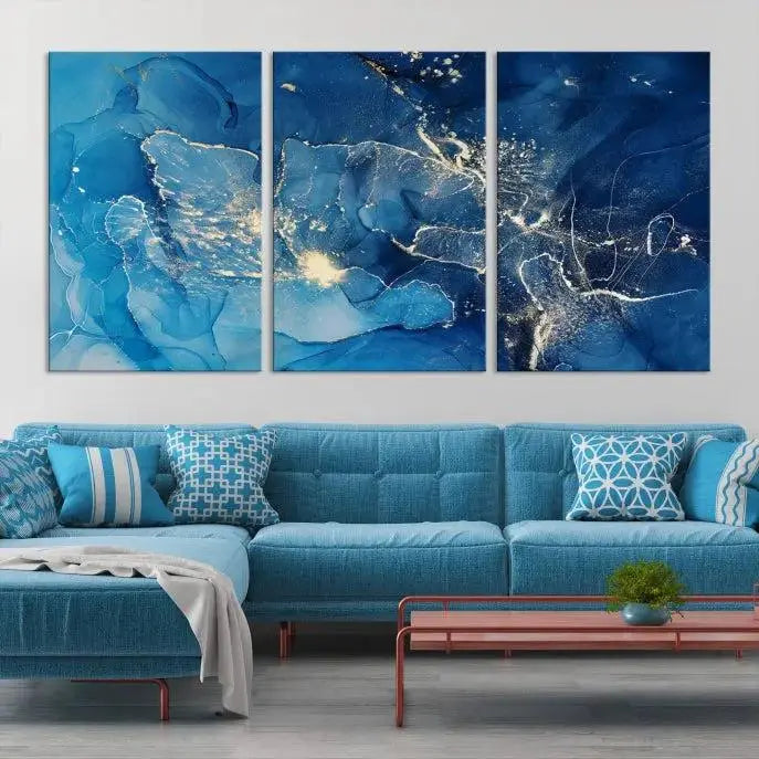 A modern living room features the "Navy Blue Marble Fluid Effect Wall Art Abstract Canvas Wall Art Print" above a white sofa. The museum-quality canvas adds an effortless touch of elegance.