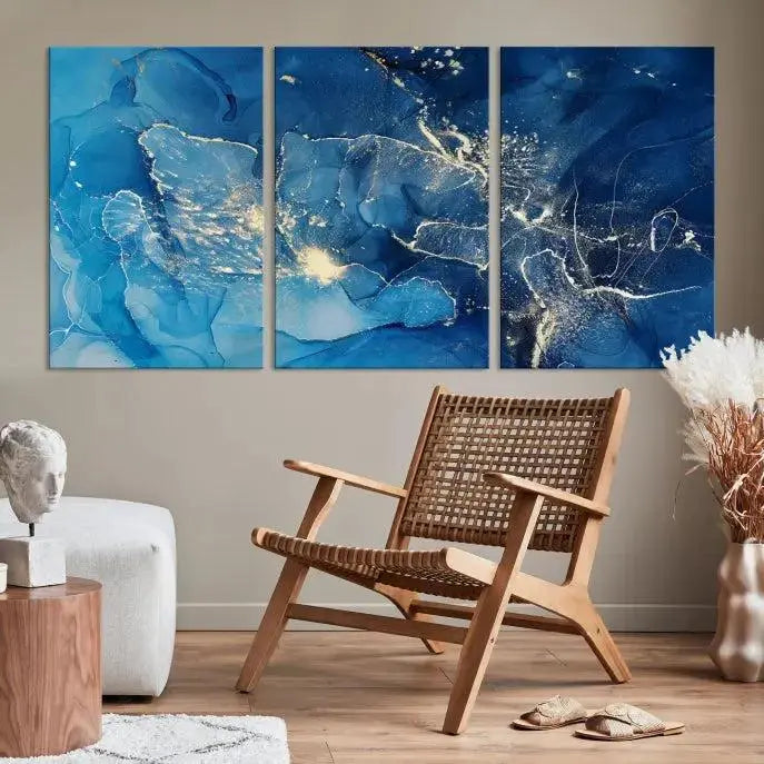 A modern living room features the "Navy Blue Marble Fluid Effect Wall Art Abstract Canvas Wall Art Print" above a white sofa. The museum-quality canvas adds an effortless touch of elegance.