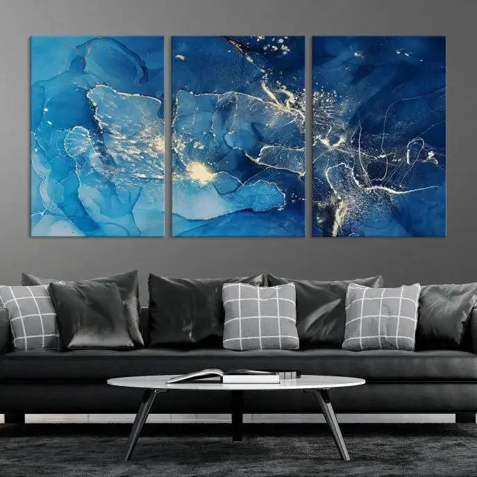 A modern living room features the "Navy Blue Marble Fluid Effect Wall Art Abstract Canvas Wall Art Print" above a white sofa. The museum-quality canvas adds an effortless touch of elegance.