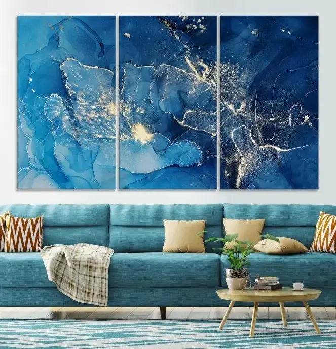 A modern living room features the "Navy Blue Marble Fluid Effect Wall Art Abstract Canvas Wall Art Print" above a white sofa. The museum-quality canvas adds an effortless touch of elegance.