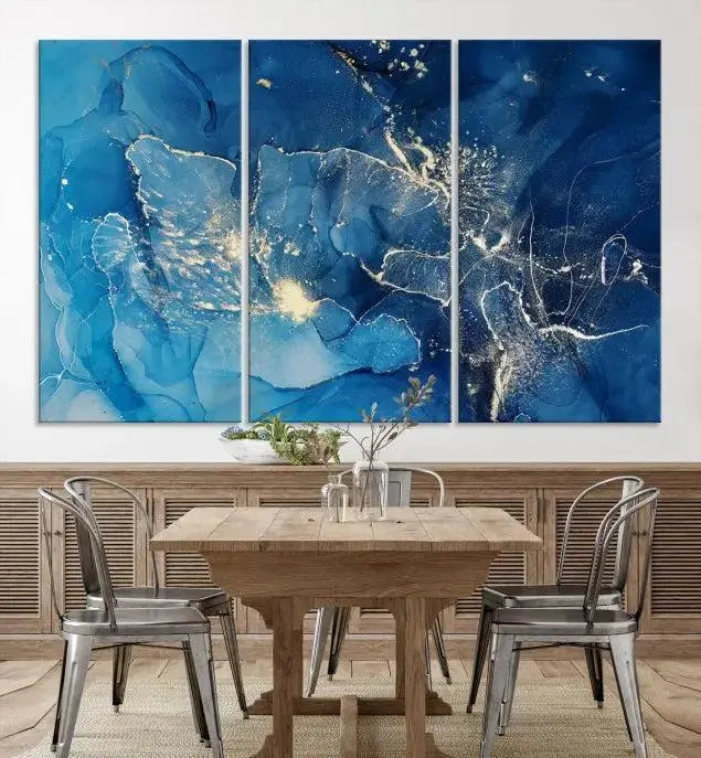 A modern living room features the "Navy Blue Marble Fluid Effect Wall Art Abstract Canvas Wall Art Print" above a white sofa. The museum-quality canvas adds an effortless touch of elegance.