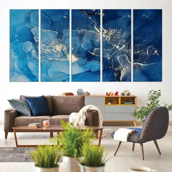 A modern living room features the "Navy Blue Marble Fluid Effect Wall Art Abstract Canvas Wall Art Print" above a white sofa. The museum-quality canvas adds an effortless touch of elegance.