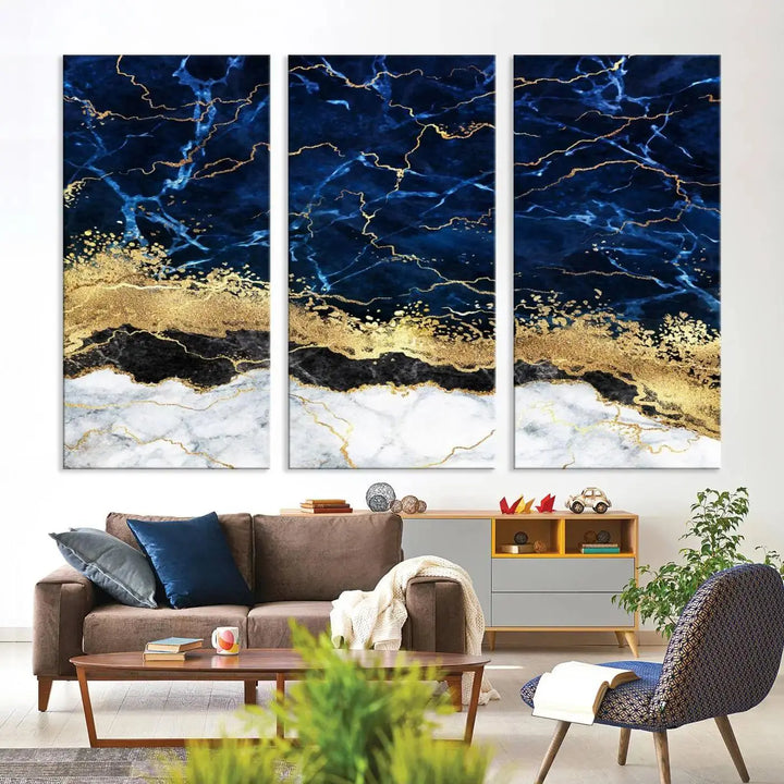 The living room is adorned with the Navy Blue Marble Fluid Effect Wall Art Abstract Canvas Wall Art Print. This ready-to-hang three-panel artwork features blue, gold, and white tones on museum-quality canvas with a UV-protective coating.