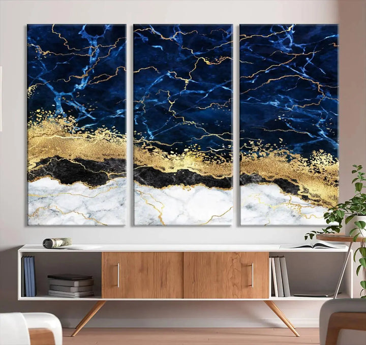 The living room is adorned with the Navy Blue Marble Fluid Effect Wall Art Abstract Canvas Wall Art Print. This ready-to-hang three-panel artwork features blue, gold, and white tones on museum-quality canvas with a UV-protective coating.