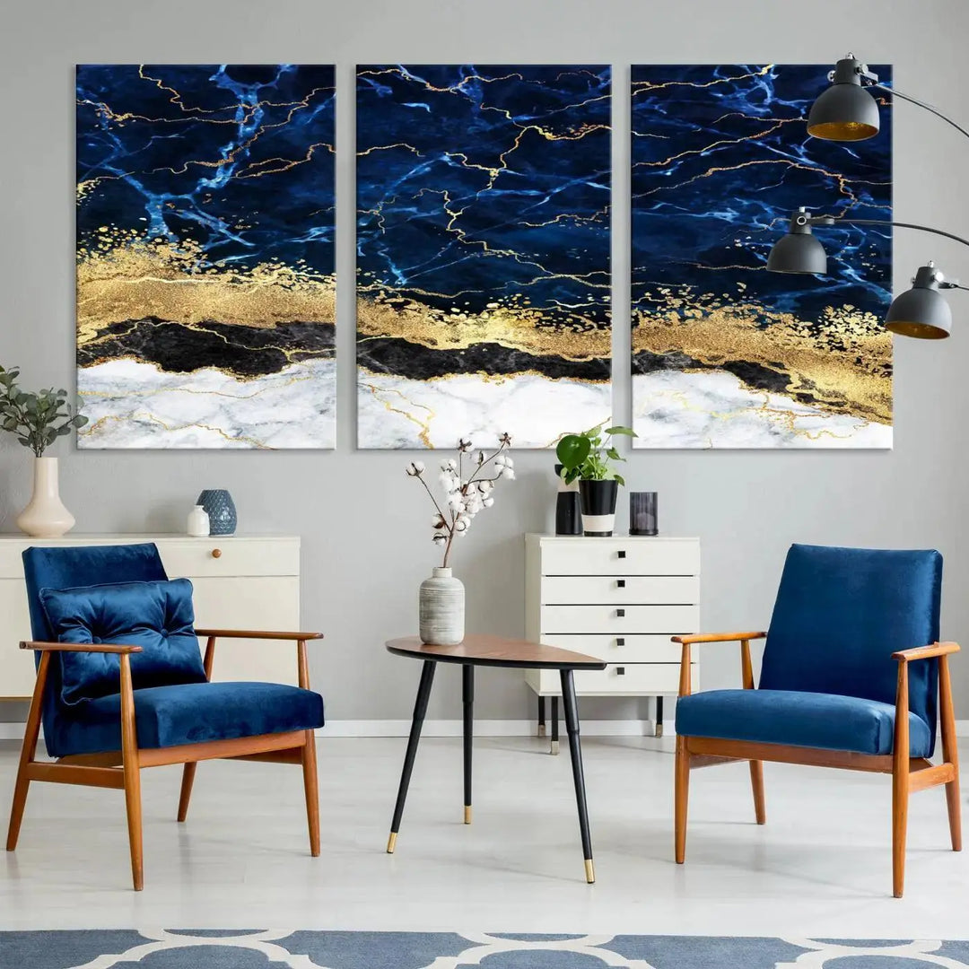 The living room is adorned with the Navy Blue Marble Fluid Effect Wall Art Abstract Canvas Wall Art Print. This ready-to-hang three-panel artwork features blue, gold, and white tones on museum-quality canvas with a UV-protective coating.