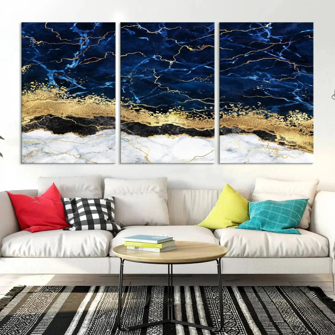 The living room is adorned with the Navy Blue Marble Fluid Effect Wall Art Abstract Canvas Wall Art Print. This ready-to-hang three-panel artwork features blue, gold, and white tones on museum-quality canvas with a UV-protective coating.