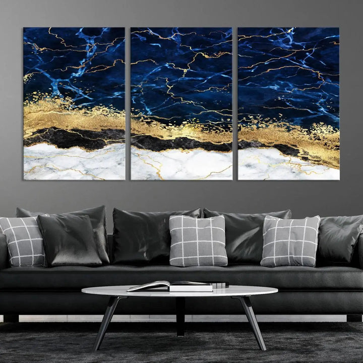 The living room is adorned with the Navy Blue Marble Fluid Effect Wall Art Abstract Canvas Wall Art Print. This ready-to-hang three-panel artwork features blue, gold, and white tones on museum-quality canvas with a UV-protective coating.