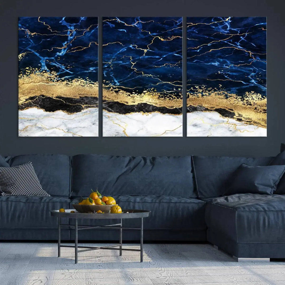 The living room is adorned with the Navy Blue Marble Fluid Effect Wall Art Abstract Canvas Wall Art Print. This ready-to-hang three-panel artwork features blue, gold, and white tones on museum-quality canvas with a UV-protective coating.