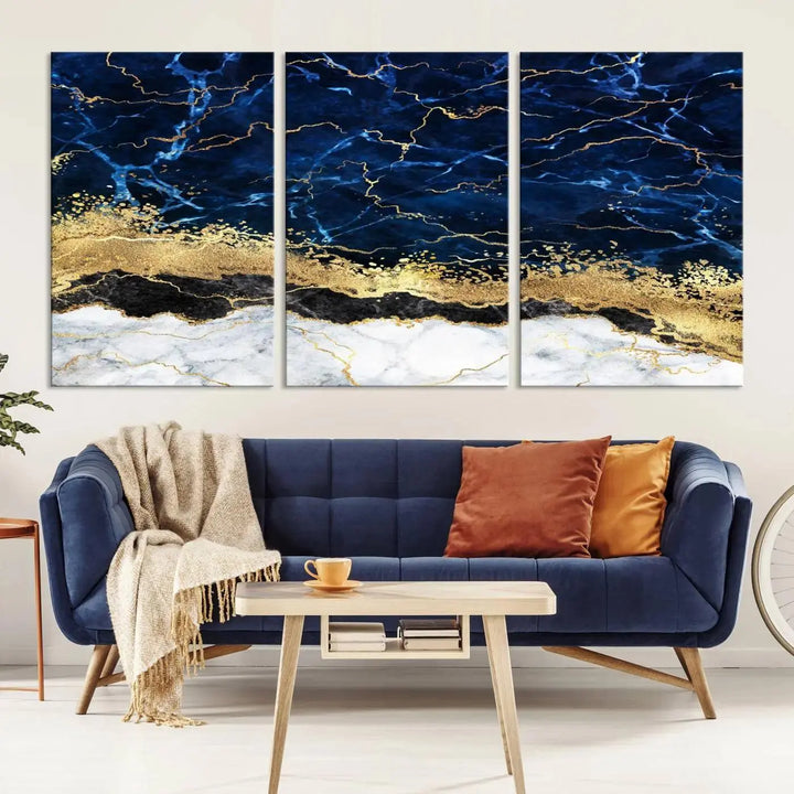 The living room is adorned with the Navy Blue Marble Fluid Effect Wall Art Abstract Canvas Wall Art Print. This ready-to-hang three-panel artwork features blue, gold, and white tones on museum-quality canvas with a UV-protective coating.