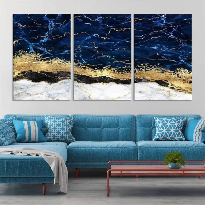 The living room is adorned with the Navy Blue Marble Fluid Effect Wall Art Abstract Canvas Wall Art Print. This ready-to-hang three-panel artwork features blue, gold, and white tones on museum-quality canvas with a UV-protective coating.