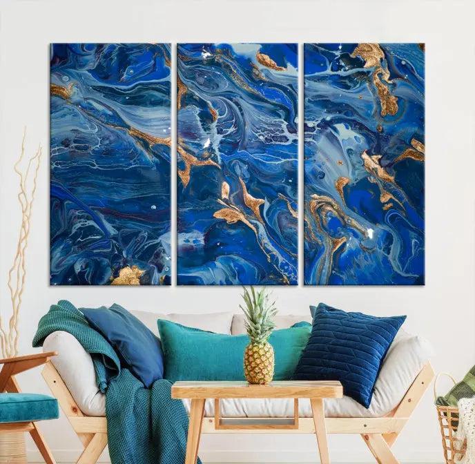 Adorn the space above your couch with the "Navy Blue Marble Fluid Effect Wall Art Abstract Canvas Wall Art Print," featuring exquisite blue and gold swirling patterns on museum-quality canvases.