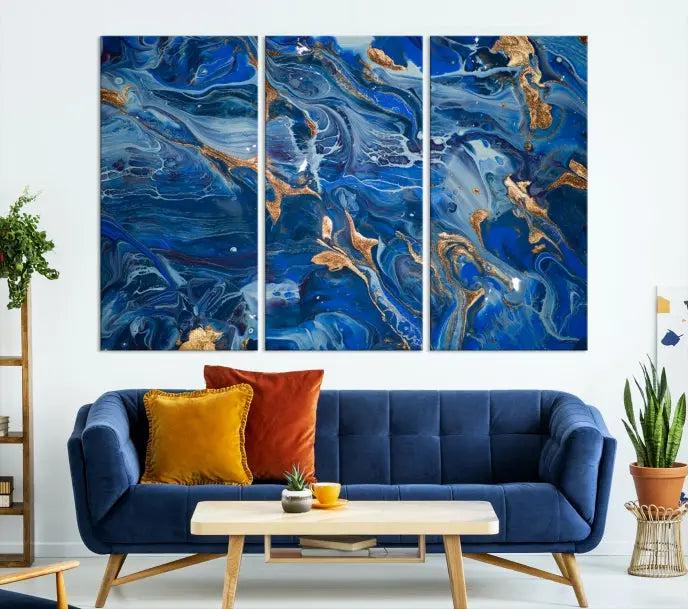 Adorn the space above your couch with the "Navy Blue Marble Fluid Effect Wall Art Abstract Canvas Wall Art Print," featuring exquisite blue and gold swirling patterns on museum-quality canvases.