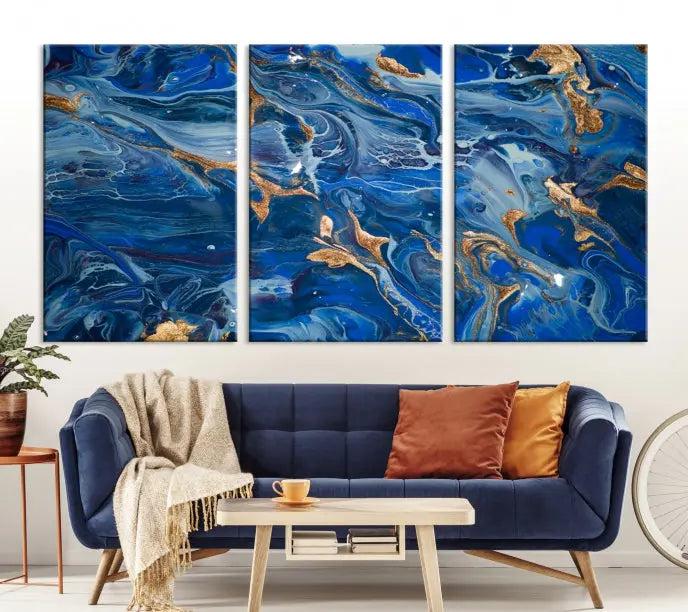 Adorn the space above your couch with the "Navy Blue Marble Fluid Effect Wall Art Abstract Canvas Wall Art Print," featuring exquisite blue and gold swirling patterns on museum-quality canvases.