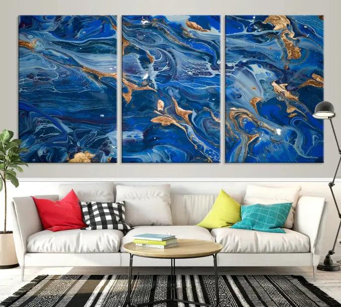 Adorn the space above your couch with the "Navy Blue Marble Fluid Effect Wall Art Abstract Canvas Wall Art Print," featuring exquisite blue and gold swirling patterns on museum-quality canvases.