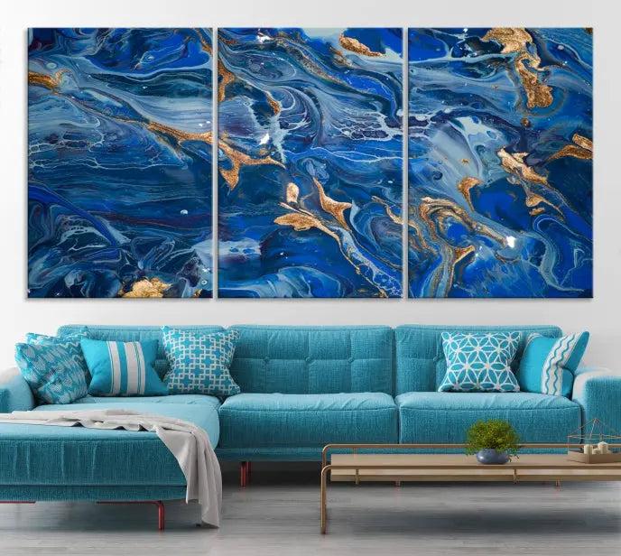 Adorn the space above your couch with the "Navy Blue Marble Fluid Effect Wall Art Abstract Canvas Wall Art Print," featuring exquisite blue and gold swirling patterns on museum-quality canvases.