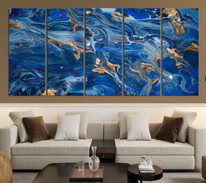 Adorn the space above your couch with the "Navy Blue Marble Fluid Effect Wall Art Abstract Canvas Wall Art Print," featuring exquisite blue and gold swirling patterns on museum-quality canvases.