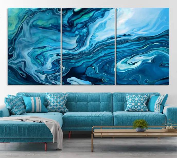 A triptych of the Navy Blue Marble Fluid Effect Wall Art Abstract Canvas Print, featuring swirling blue patterns, graces the space. These pieces are crafted on museum-quality canvas and gallery wrapped with a UV-protective coating to ensure longevity.