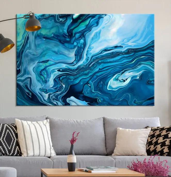 A triptych of the Navy Blue Marble Fluid Effect Wall Art Abstract Canvas Print, featuring swirling blue patterns, graces the space. These pieces are crafted on museum-quality canvas and gallery wrapped with a UV-protective coating to ensure longevity.