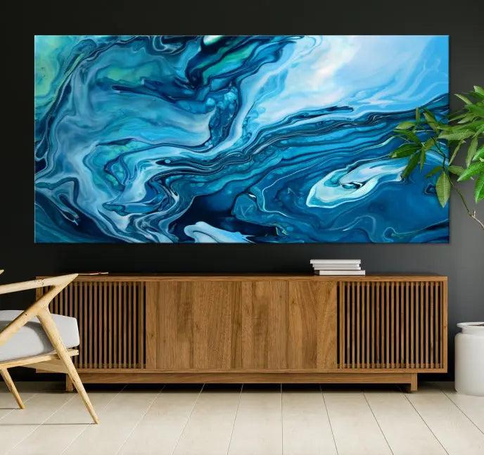 A triptych of the Navy Blue Marble Fluid Effect Wall Art Abstract Canvas Print, featuring swirling blue patterns, graces the space. These pieces are crafted on museum-quality canvas and gallery wrapped with a UV-protective coating to ensure longevity.