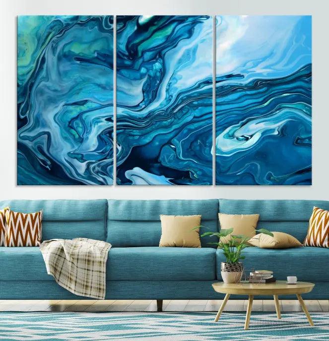 A triptych of the Navy Blue Marble Fluid Effect Wall Art Abstract Canvas Print, featuring swirling blue patterns, graces the space. These pieces are crafted on museum-quality canvas and gallery wrapped with a UV-protective coating to ensure longevity.