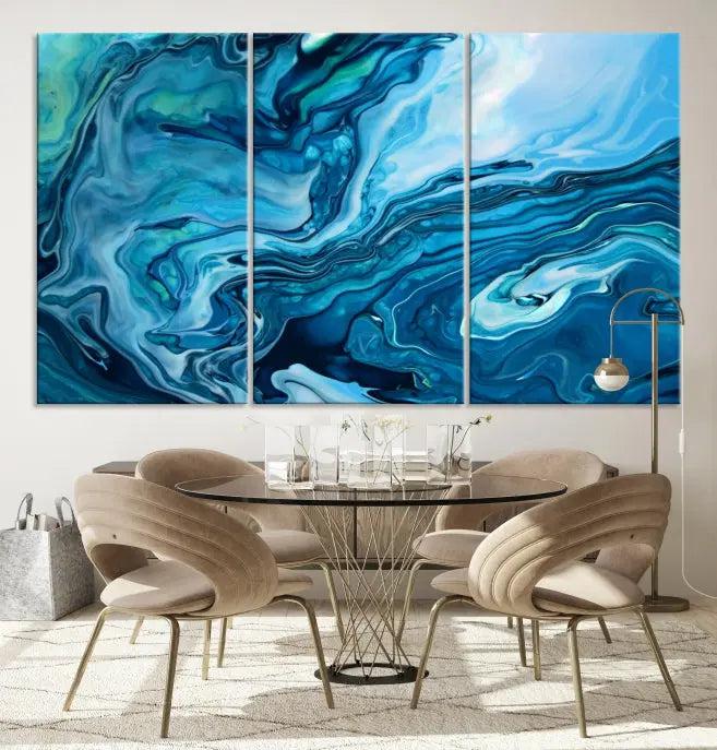 A triptych of the Navy Blue Marble Fluid Effect Wall Art Abstract Canvas Print, featuring swirling blue patterns, graces the space. These pieces are crafted on museum-quality canvas and gallery wrapped with a UV-protective coating to ensure longevity.