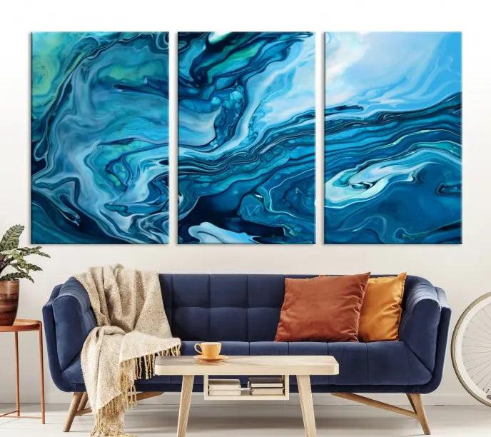 A triptych of the Navy Blue Marble Fluid Effect Wall Art Abstract Canvas Print, featuring swirling blue patterns, graces the space. These pieces are crafted on museum-quality canvas and gallery wrapped with a UV-protective coating to ensure longevity.