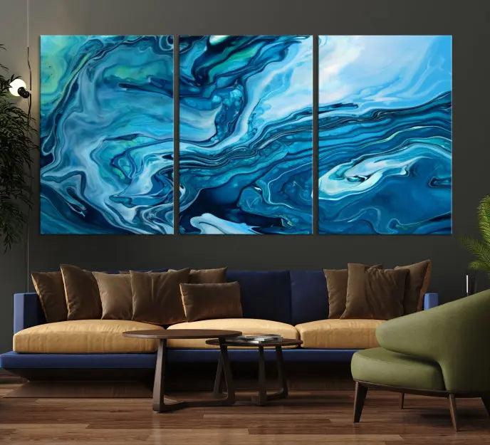 A triptych of the Navy Blue Marble Fluid Effect Wall Art Abstract Canvas Print, featuring swirling blue patterns, graces the space. These pieces are crafted on museum-quality canvas and gallery wrapped with a UV-protective coating to ensure longevity.