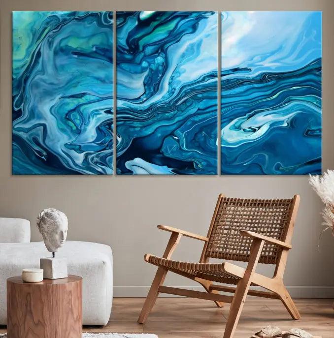 A triptych of the Navy Blue Marble Fluid Effect Wall Art Abstract Canvas Print, featuring swirling blue patterns, graces the space. These pieces are crafted on museum-quality canvas and gallery wrapped with a UV-protective coating to ensure longevity.