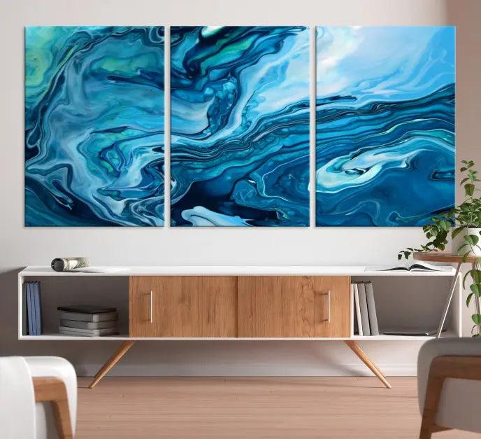 A triptych of the Navy Blue Marble Fluid Effect Wall Art Abstract Canvas Print, featuring swirling blue patterns, graces the space. These pieces are crafted on museum-quality canvas and gallery wrapped with a UV-protective coating to ensure longevity.