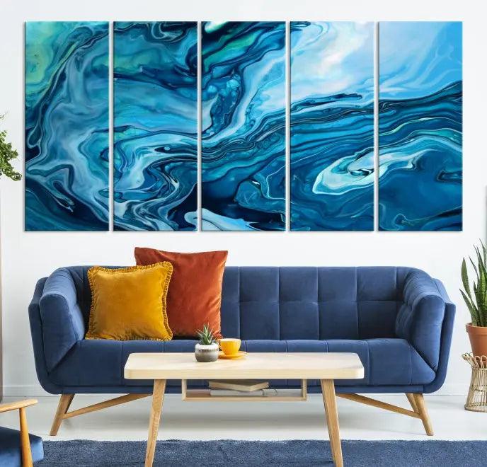 A triptych of the Navy Blue Marble Fluid Effect Wall Art Abstract Canvas Print, featuring swirling blue patterns, graces the space. These pieces are crafted on museum-quality canvas and gallery wrapped with a UV-protective coating to ensure longevity.