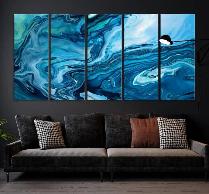 A triptych of the Navy Blue Marble Fluid Effect Wall Art Abstract Canvas Print, featuring swirling blue patterns, graces the space. These pieces are crafted on museum-quality canvas and gallery wrapped with a UV-protective coating to ensure longevity.