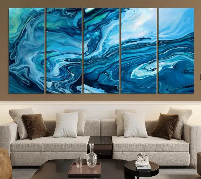 A triptych of the Navy Blue Marble Fluid Effect Wall Art Abstract Canvas Print, featuring swirling blue patterns, graces the space. These pieces are crafted on museum-quality canvas and gallery wrapped with a UV-protective coating to ensure longevity.