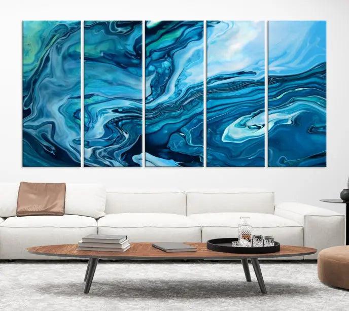 A triptych of the Navy Blue Marble Fluid Effect Wall Art Abstract Canvas Print, featuring swirling blue patterns, graces the space. These pieces are crafted on museum-quality canvas and gallery wrapped with a UV-protective coating to ensure longevity.