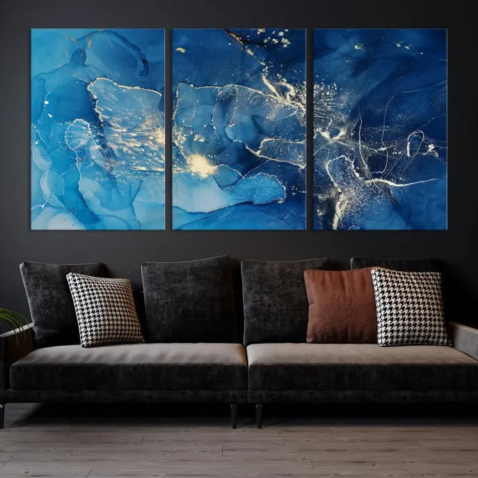 A modern living room features the "Navy Blue Marble Fluid Effect Wall Art Abstract Canvas Wall Art Print" above a white sofa. The museum-quality canvas adds an effortless touch of elegance.