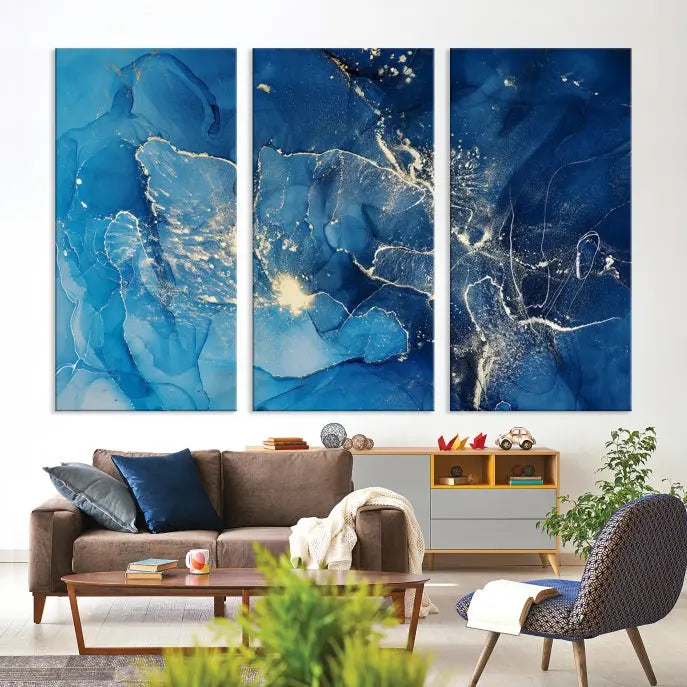 A modern living room features the "Navy Blue Marble Fluid Effect Wall Art Abstract Canvas Wall Art Print" above a white sofa. The museum-quality canvas adds an effortless touch of elegance.