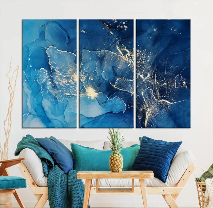 A modern living room features the "Navy Blue Marble Fluid Effect Wall Art Abstract Canvas Wall Art Print" above a white sofa. The museum-quality canvas adds an effortless touch of elegance.