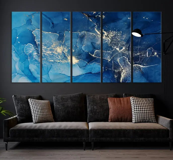 A modern living room features the "Navy Blue Marble Fluid Effect Wall Art Abstract Canvas Wall Art Print" above a white sofa. The museum-quality canvas adds an effortless touch of elegance.