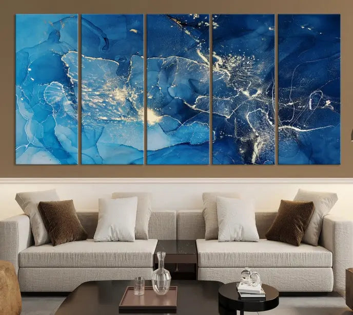 A modern living room features the "Navy Blue Marble Fluid Effect Wall Art Abstract Canvas Wall Art Print" above a white sofa. The museum-quality canvas adds an effortless touch of elegance.