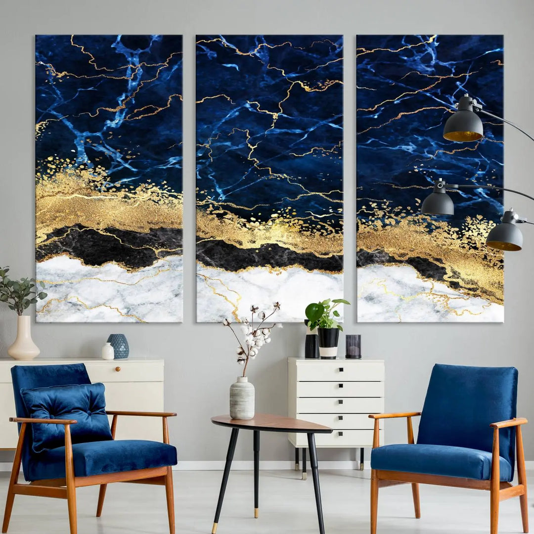 The living room is adorned with the Navy Blue Marble Fluid Effect Wall Art Abstract Canvas Wall Art Print. This ready-to-hang three-panel artwork features blue, gold, and white tones on museum-quality canvas with a UV-protective coating.