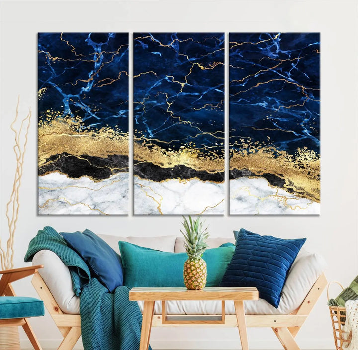 The living room is adorned with the Navy Blue Marble Fluid Effect Wall Art Abstract Canvas Wall Art Print. This ready-to-hang three-panel artwork features blue, gold, and white tones on museum-quality canvas with a UV-protective coating.