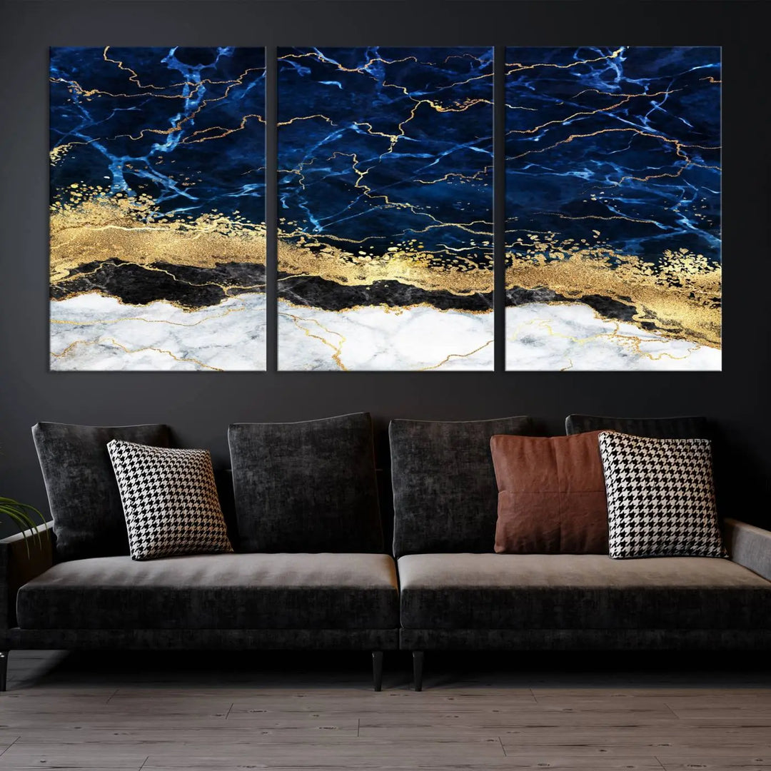 The living room is adorned with the Navy Blue Marble Fluid Effect Wall Art Abstract Canvas Wall Art Print. This ready-to-hang three-panel artwork features blue, gold, and white tones on museum-quality canvas with a UV-protective coating.