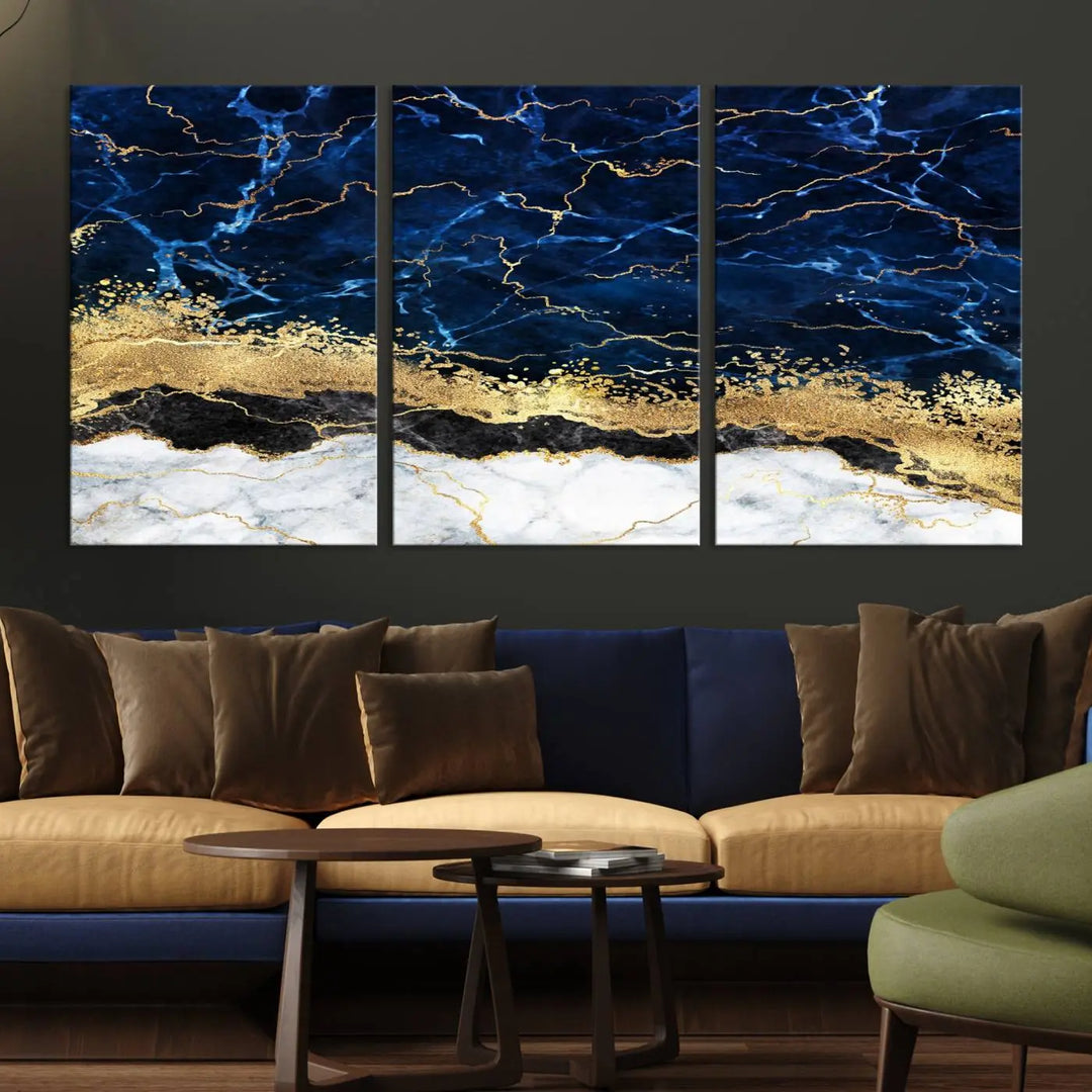 The living room is adorned with the Navy Blue Marble Fluid Effect Wall Art Abstract Canvas Wall Art Print. This ready-to-hang three-panel artwork features blue, gold, and white tones on museum-quality canvas with a UV-protective coating.