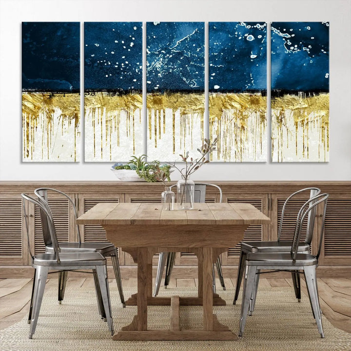 The Navy Blue Marble Fluid Effect Wall Art Abstract Canvas Print, a three-panel piece featuring blue, gold, and white colors on gallery-wrapped canvas, adorns the wall in a modern room. The museum-quality canvas ensures an elegant touch.