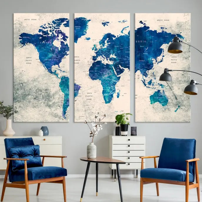 A Navy Blue Push Pin World Map Wall Art Canvas Print, displayed as a triptych on gallery-wrapped, museum-quality canvas, hangs on the wall.