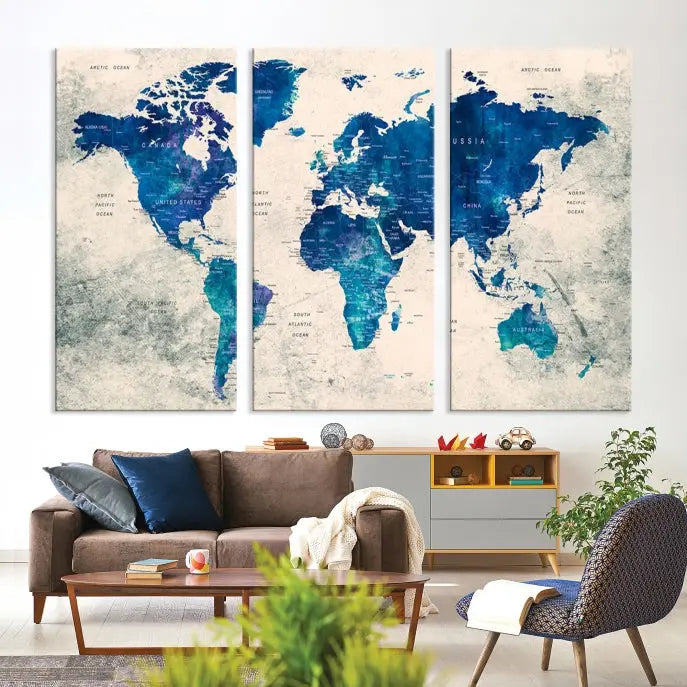 A Navy Blue Push Pin World Map Wall Art Canvas Print, displayed as a triptych on gallery-wrapped, museum-quality canvas, hangs on the wall.