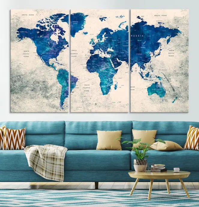 A Navy Blue Push Pin World Map Wall Art Canvas Print, displayed as a triptych on gallery-wrapped, museum-quality canvas, hangs on the wall.