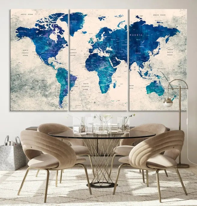 A Navy Blue Push Pin World Map Wall Art Canvas Print, displayed as a triptych on gallery-wrapped, museum-quality canvas, hangs on the wall.