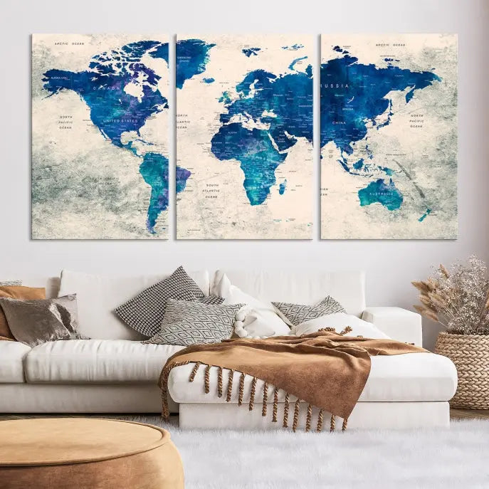 A Navy Blue Push Pin World Map Wall Art Canvas Print, displayed as a triptych on gallery-wrapped, museum-quality canvas, hangs on the wall.